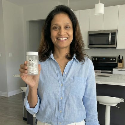 A customer holding the product